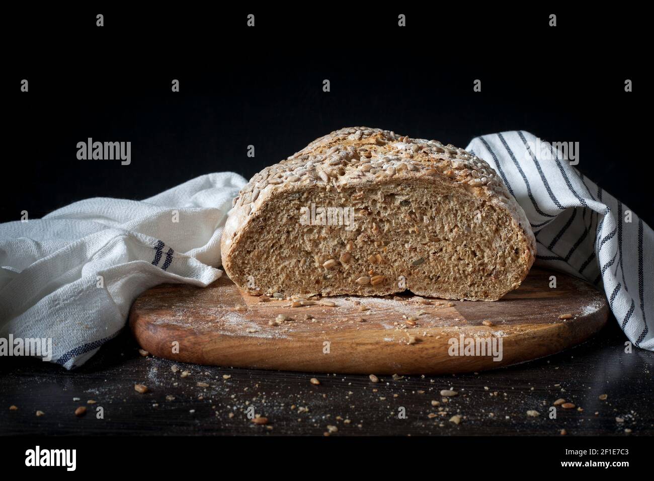 Freshly baked bread in tea towel Stock Photo