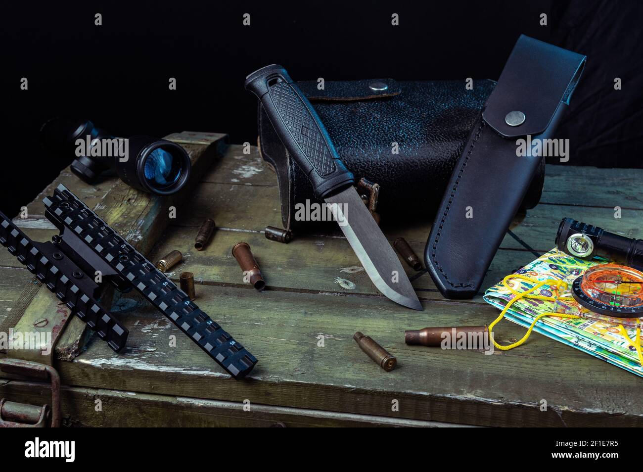 An army black knife with a fixed blade. Knife and leather sheath