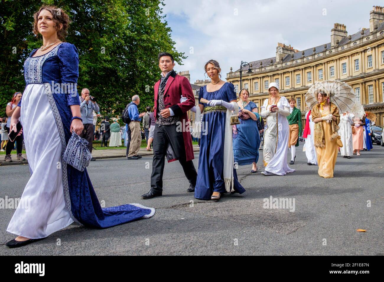 Bath, UK.15-08-2018. Jane Austen fans taking part in the world-famous Grand Regency Costumed Promenade are pictured as they walk around the Circus. Stock Photo