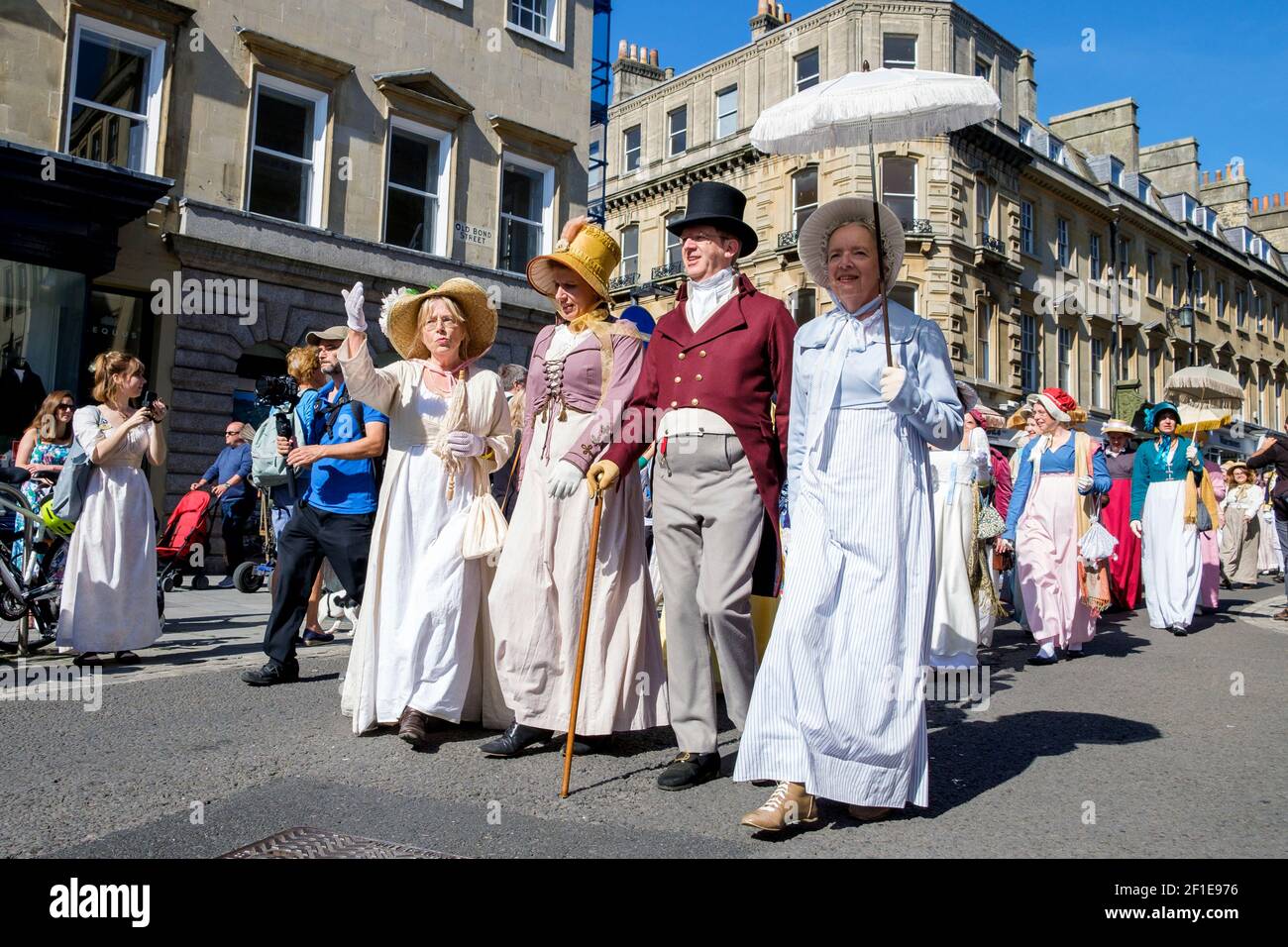 Bath, UK.15/09/2019 Jane Austen fans taking part in the world-famous Grand Regency Costumed Promenade are pictured as they walk down Milsom Street. Stock Photo