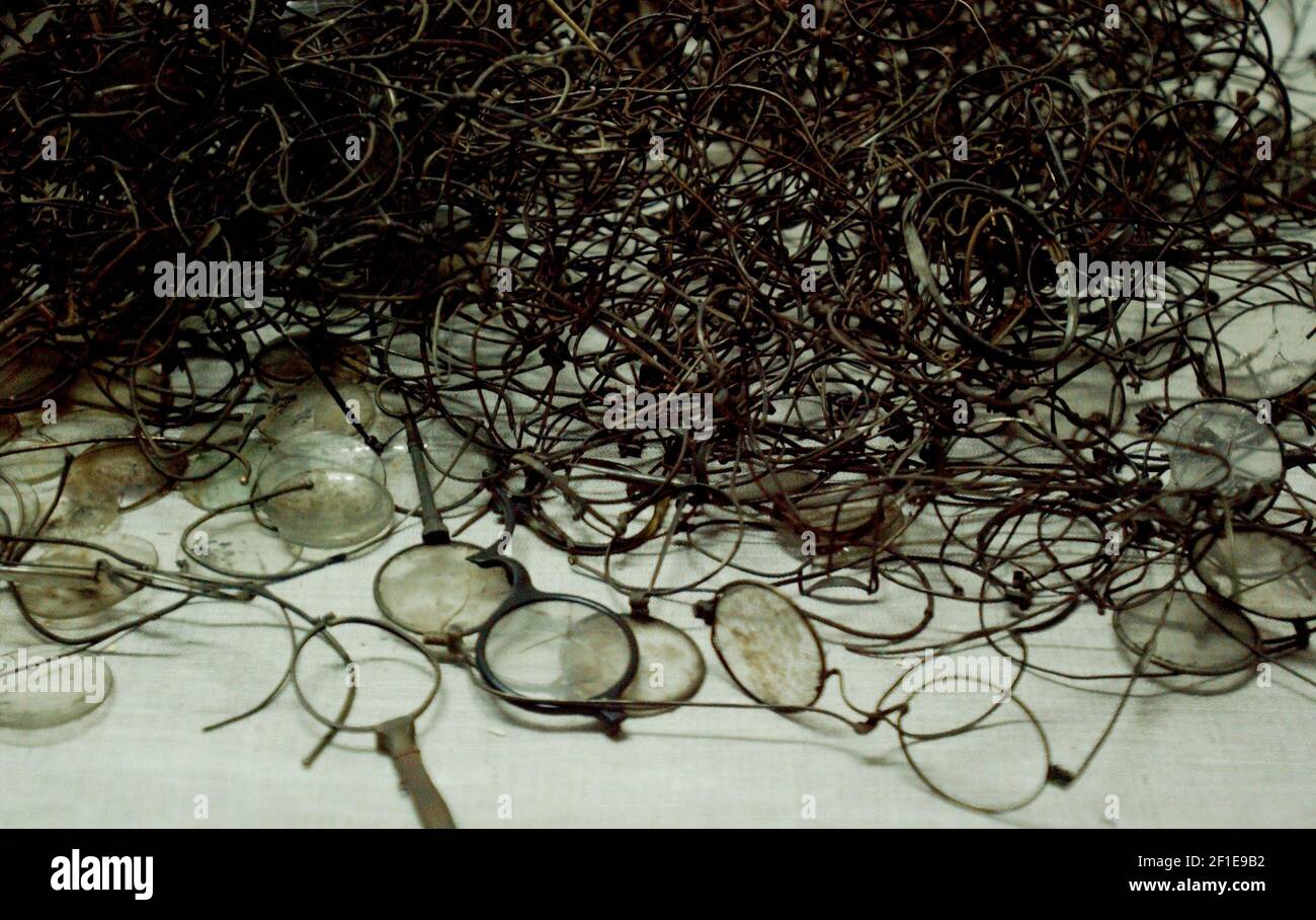 GLASSES TAKEN FROM PRISONERS AT AUSCHWITZ ,NOW ON DISPLAY THERE..20/1