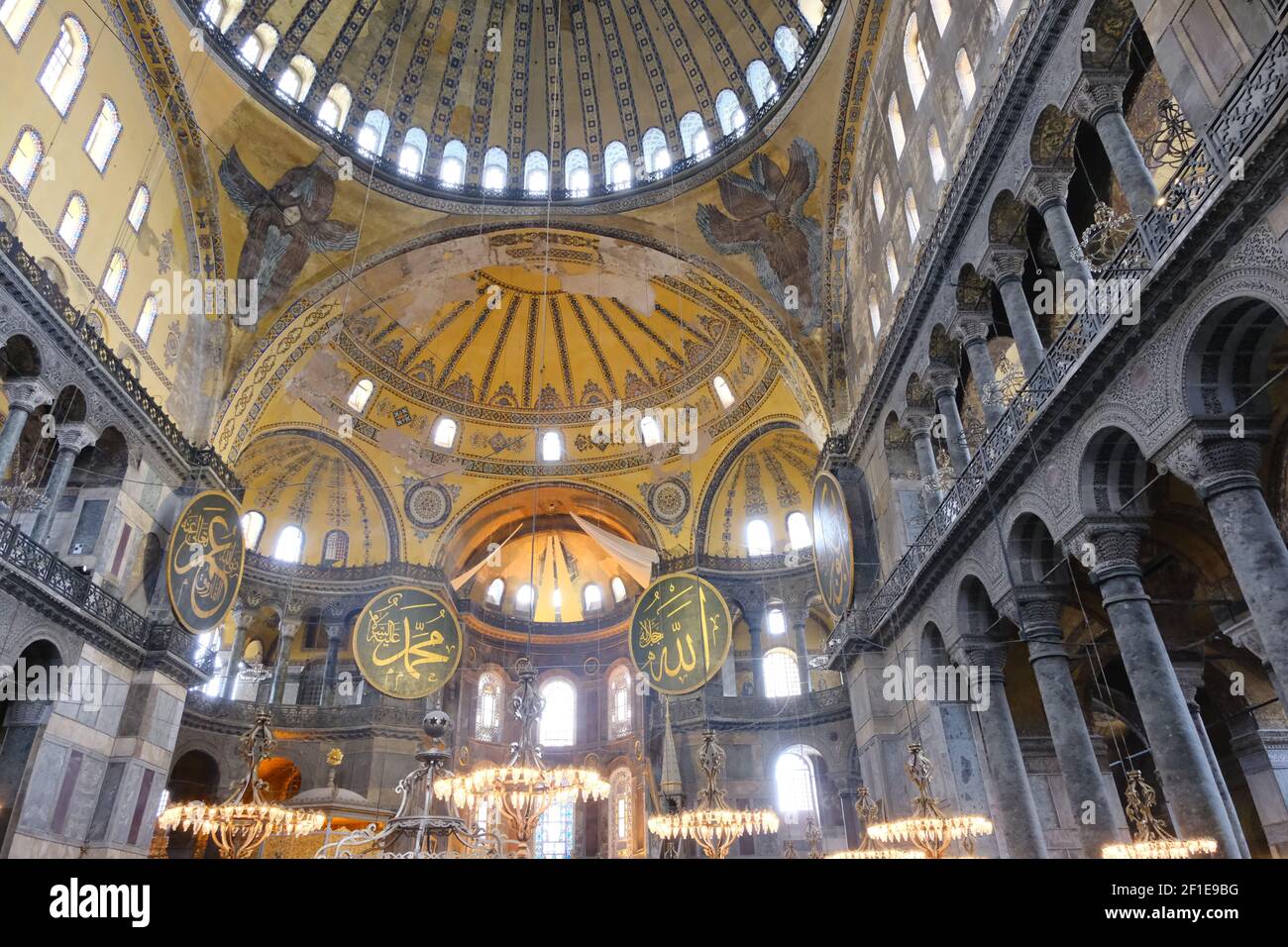 Hagia sophia mosque inside.many etching and gravures name of prophet Muhammad, god, ancient candles. Architectural details of dome and ancient windows Stock Photo