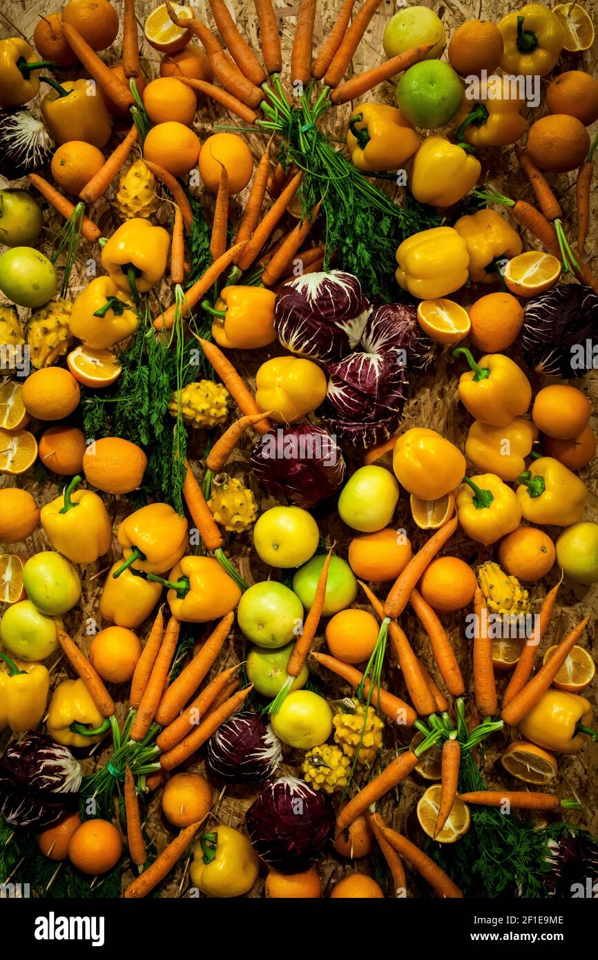 A pile of different orange and yellow fruits and vegetables Stock Photo Alamy