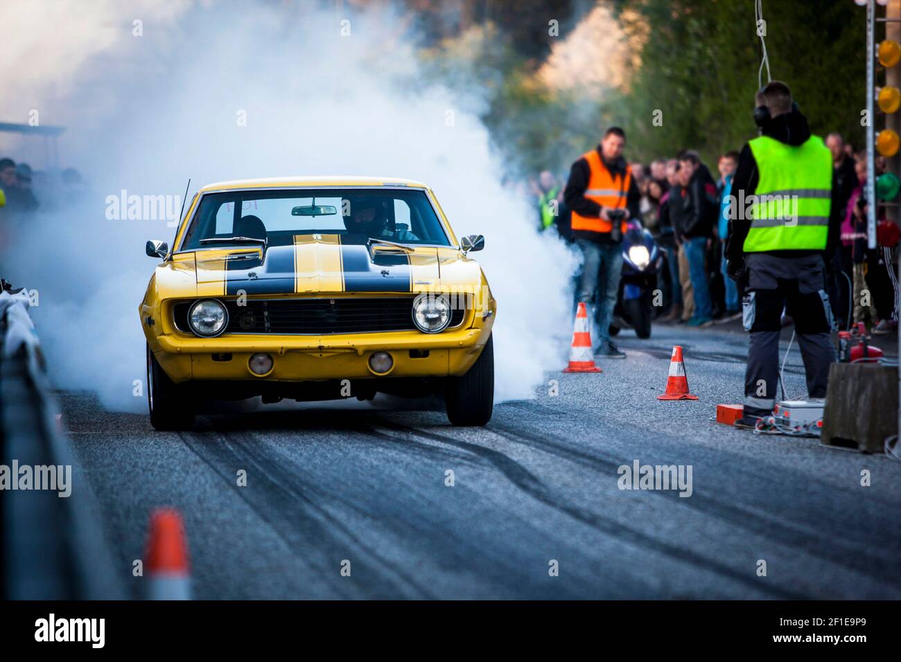 A yellow race-car at a racing event Stock Photo - Alamy