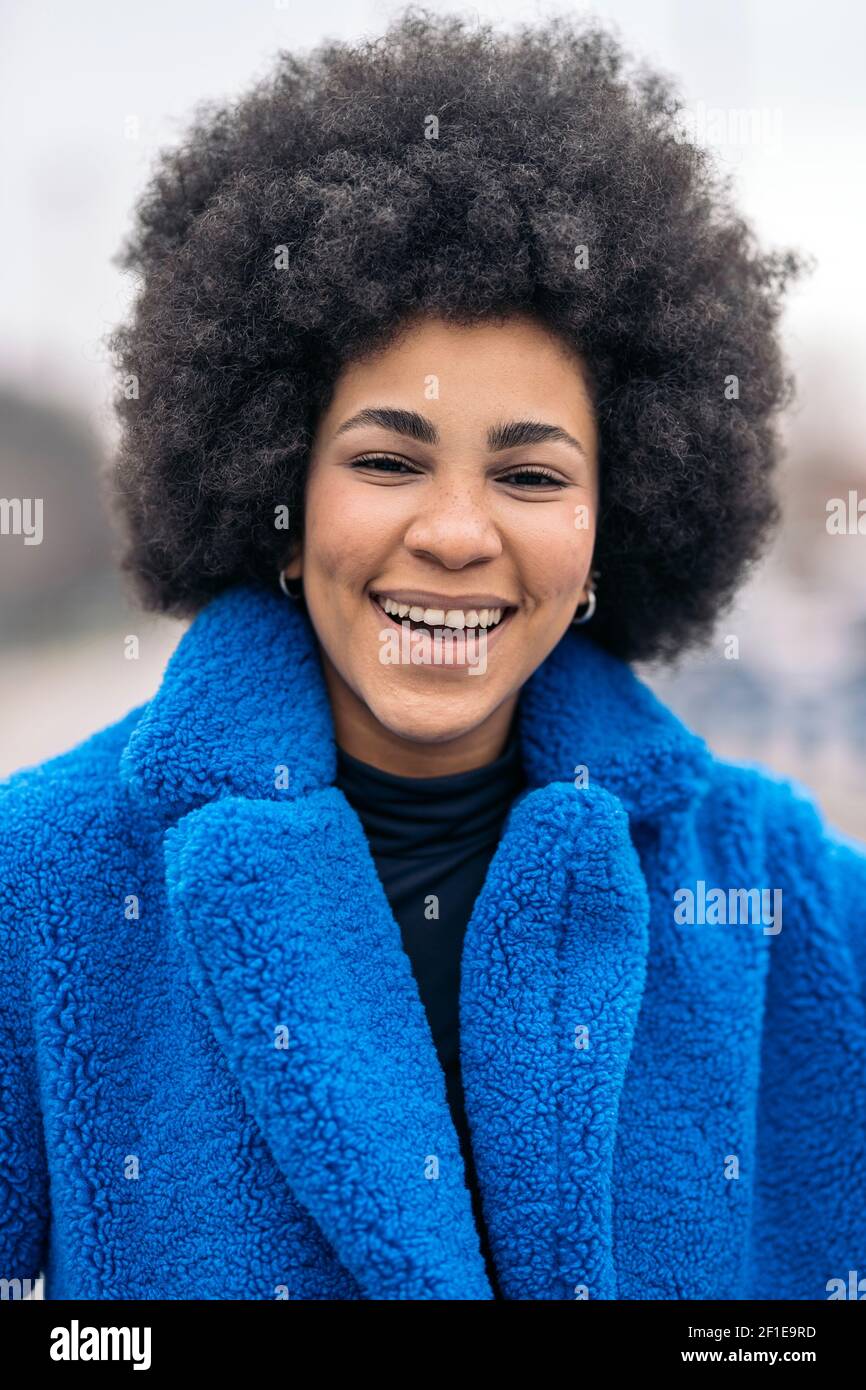 Stock photo of beautiful african american girl smiling and looking at ...