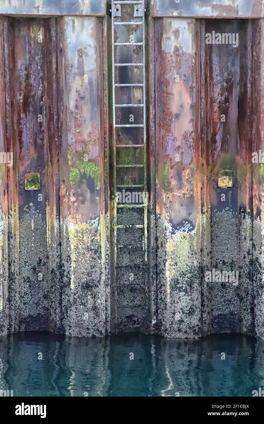 Rusty pier with ladder Stock Photo Alamy