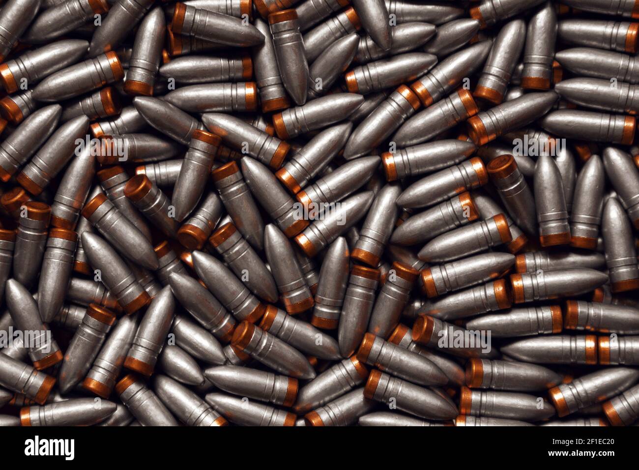 Pattern of bullet. Many lead bullets with copper bottom Stock Photo