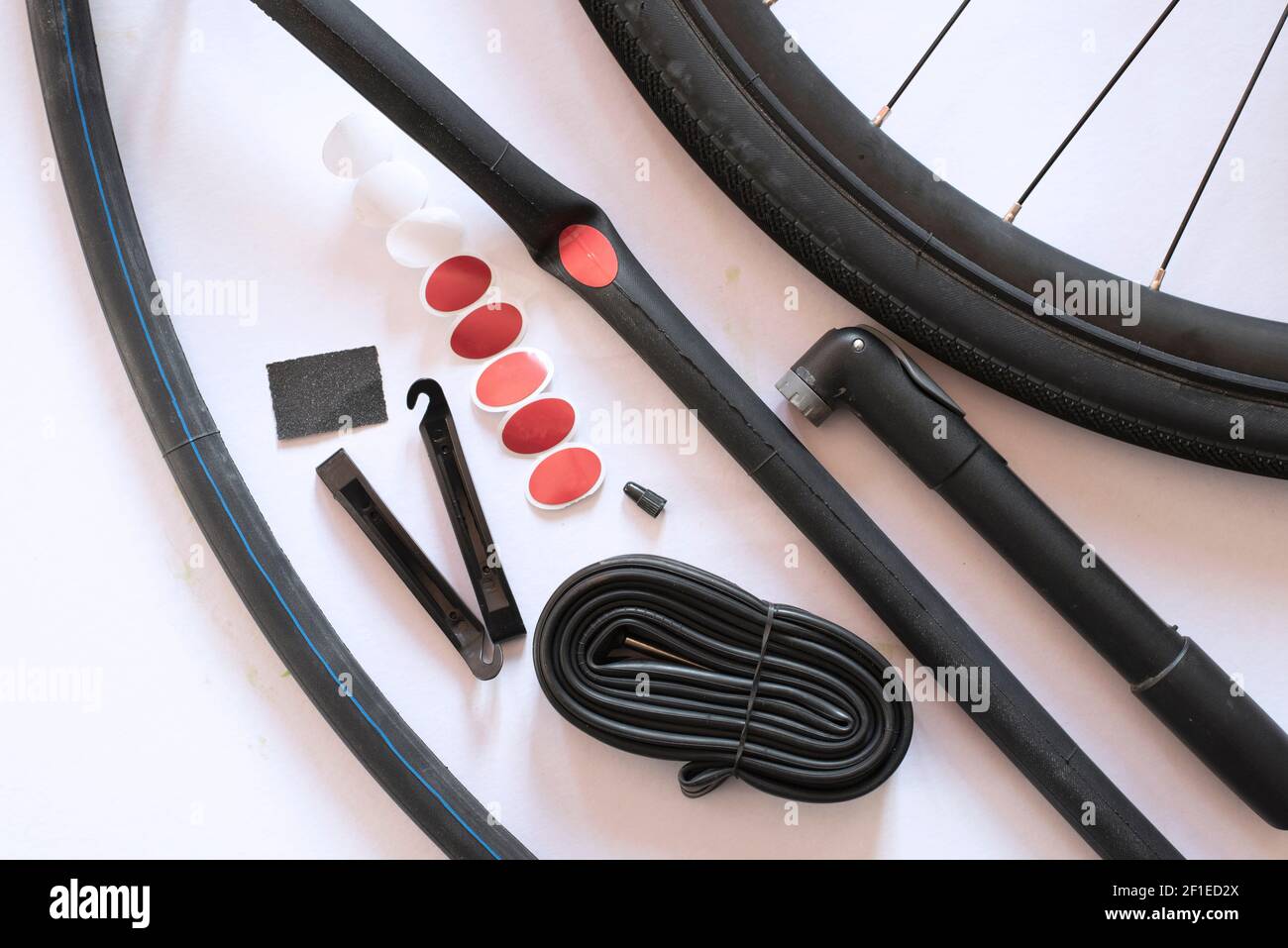 Bicycle tube repairing tools on white background. Concept of essential