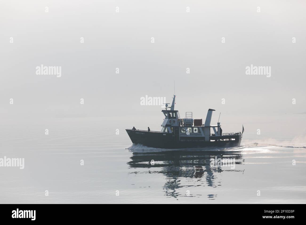 Cobh, Cork, Ireland. 08th March, 2021. Naval ferry Kaycraft sails through the harbour in early morning fog as she transports naval service members to the navy base at Haulbowline from Cobh, Co. Cork, Ireland. - Credit; David Creedon / Alamy Live News Stock Photo