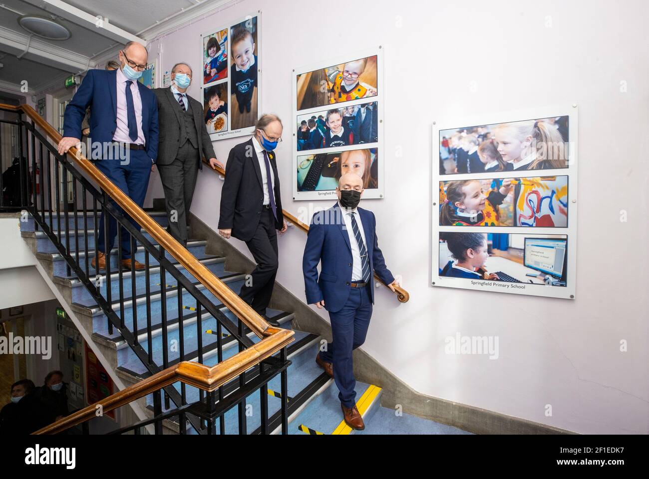 Northern Ireland Education Minister Peter Weir (second right) is guide ...