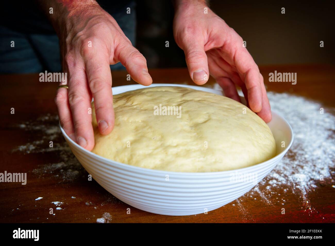 Preparing dough for white bread, rolls, pizza. Yeast dough made from