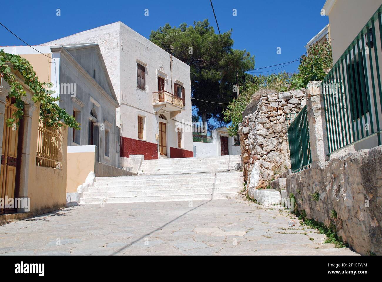 The Kali Strata steps at Yialos on the Greek island of Symi. The steps lead to the village of Chorio above. Stock Photo