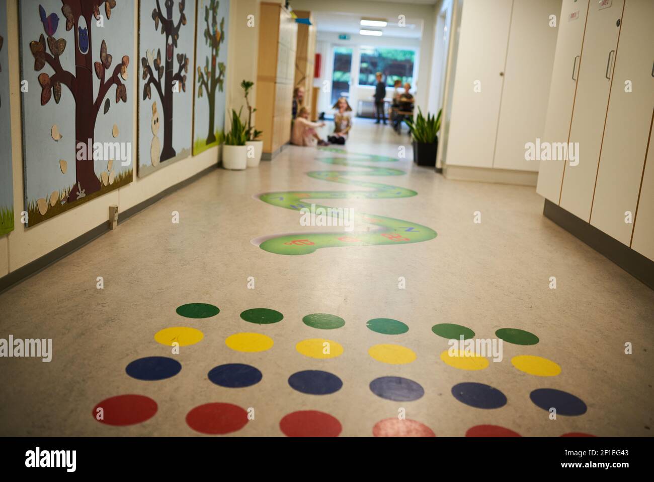 Colorful game for kids on the floor in school hallway Stock Photo