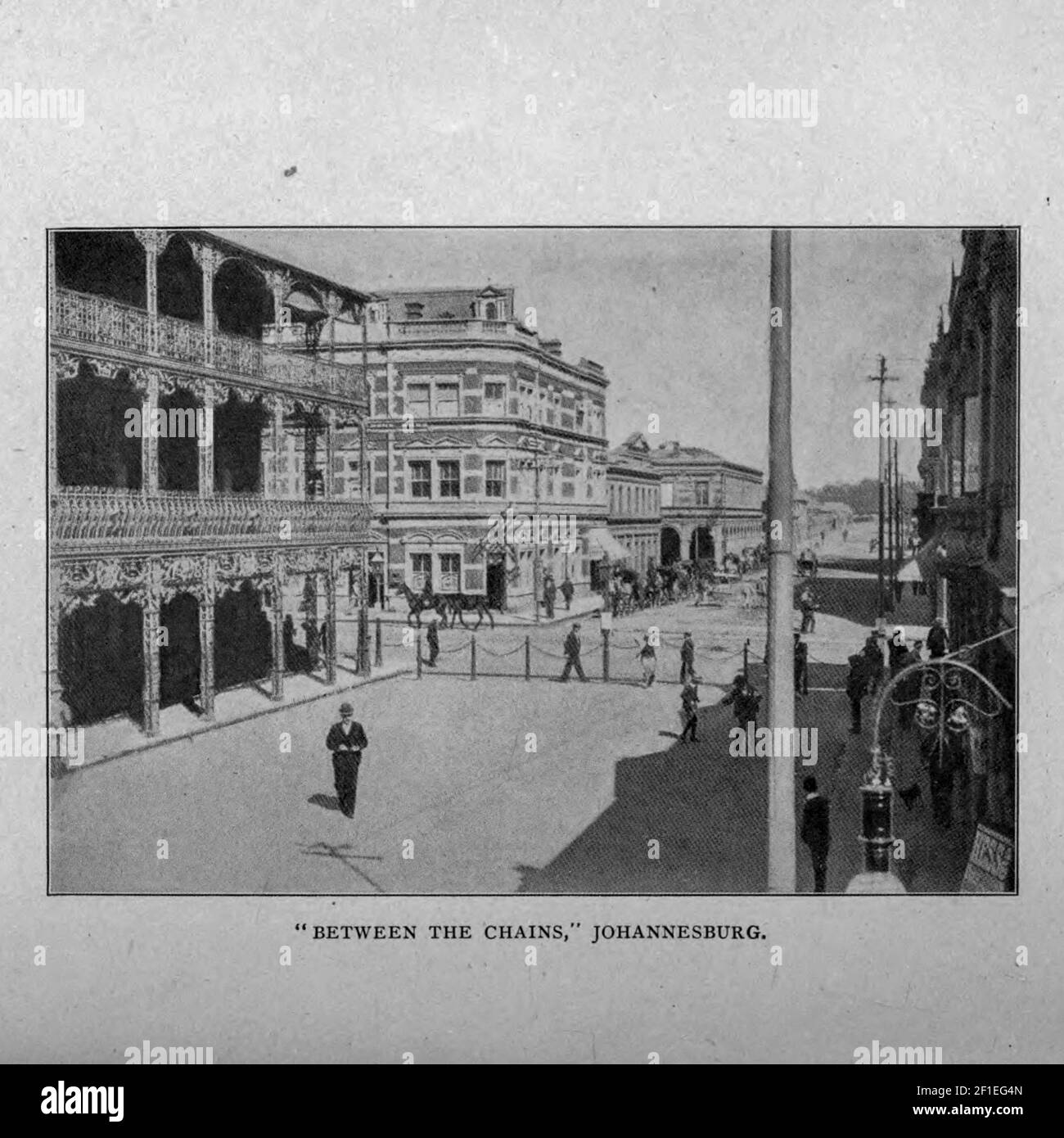 Between the Chains Johannesburg [This is the financial heart of the Witwatersrand, and, it may be said, of South Africa. A portion of Simmonds Street, between Commissioner and Pritchard Streets, has been railed off to prevent vehicular traffic passing through] from the book ' Boer and Britisher in South Africa; a history of the Boer-British war and the wars for United South Africa, together with biographies of the great men who made the history of South Africa ' By Neville, John Ormond Published by Thompson & Thomas, Chicago, USA in 1900 Stock Photo