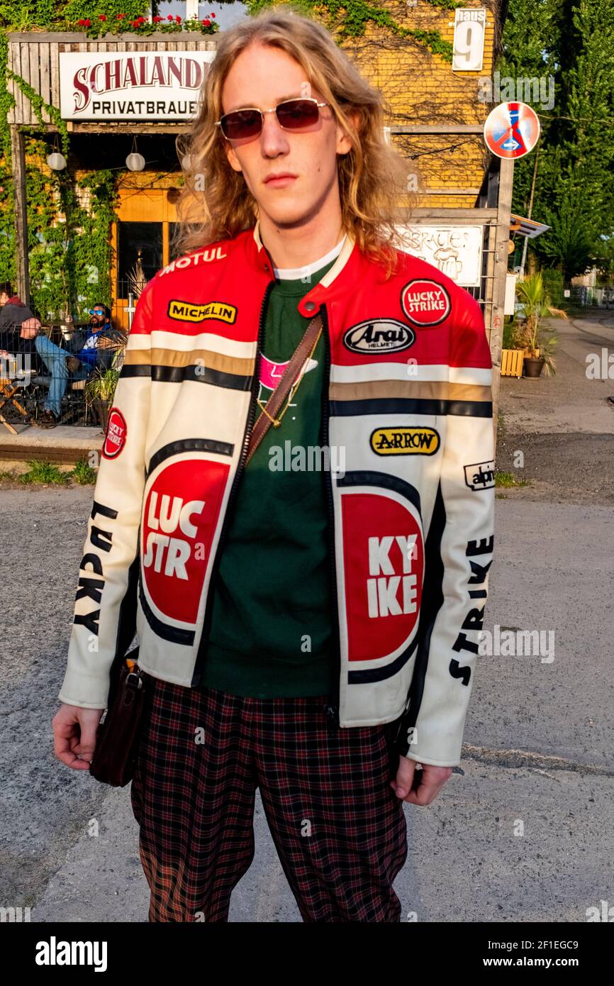 Berlin, Germany. Young adult, male music student roaming the streets of the German capitol during his spare time, meeting old and new friends. Stock Photo