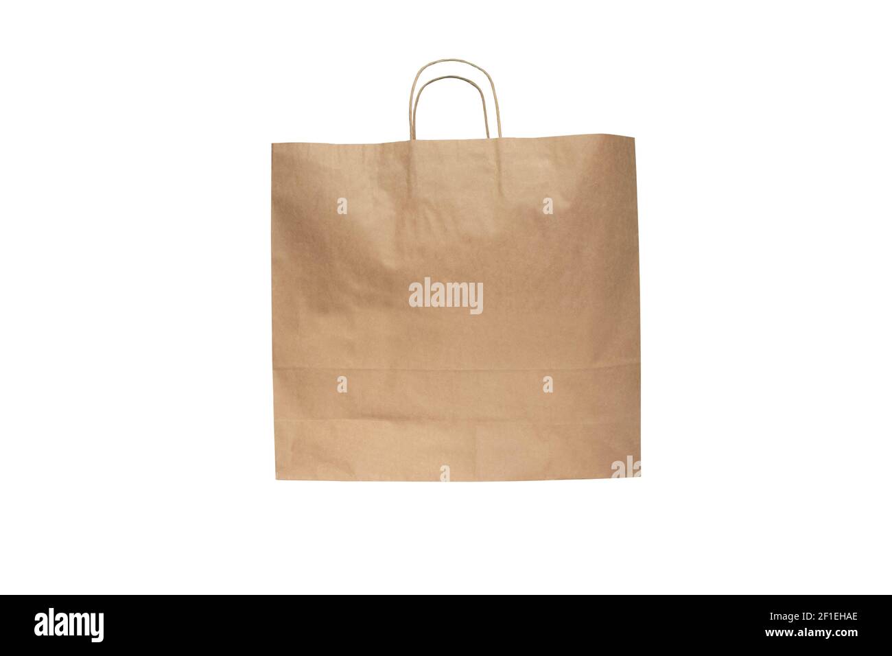 Shopping kraft paper bag with handles isolated on white. Stock Photo