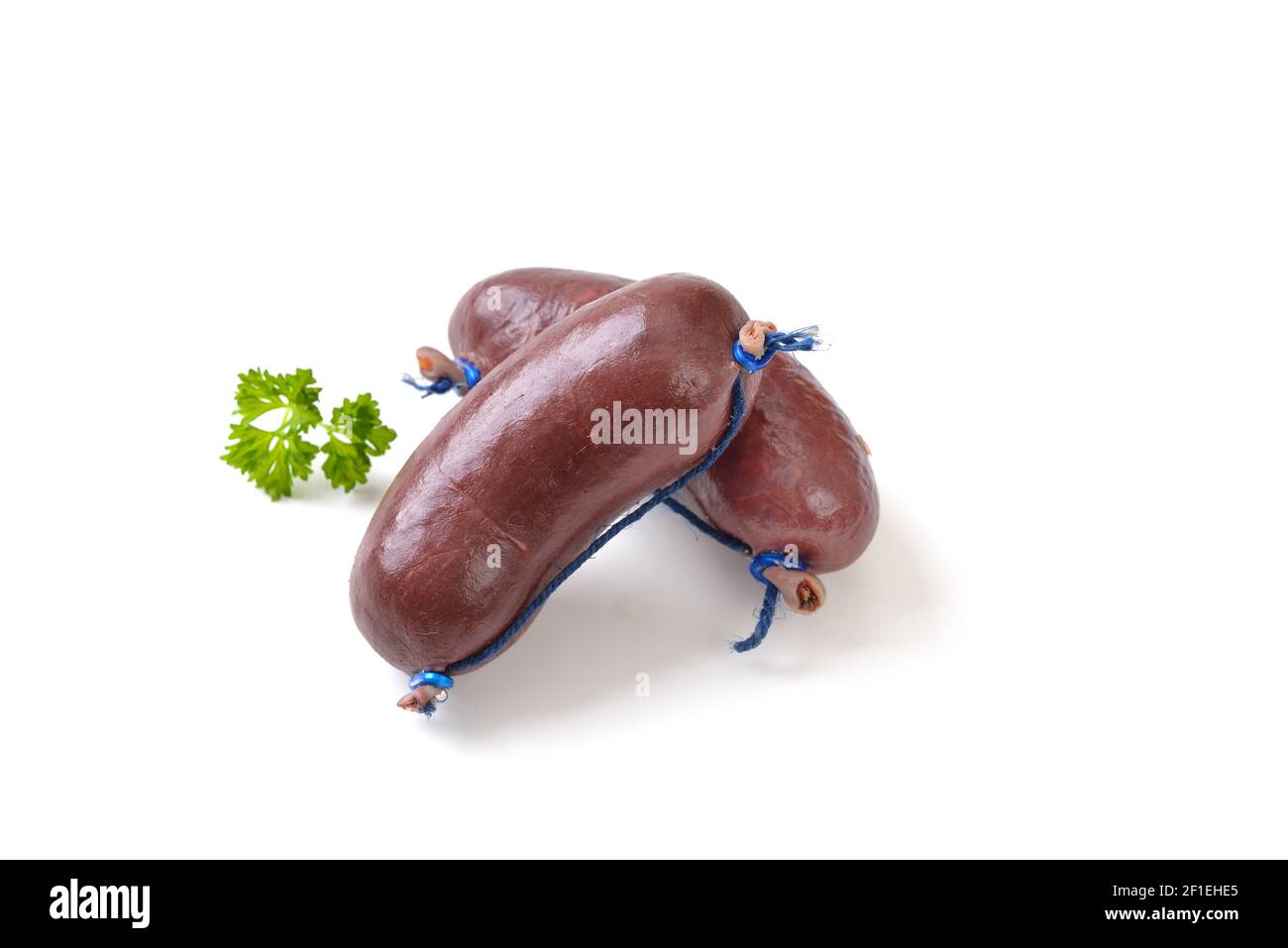 Two fresh Bavarian black pudding sausages, such as those used for hearty meat platters, on white background Stock Photo