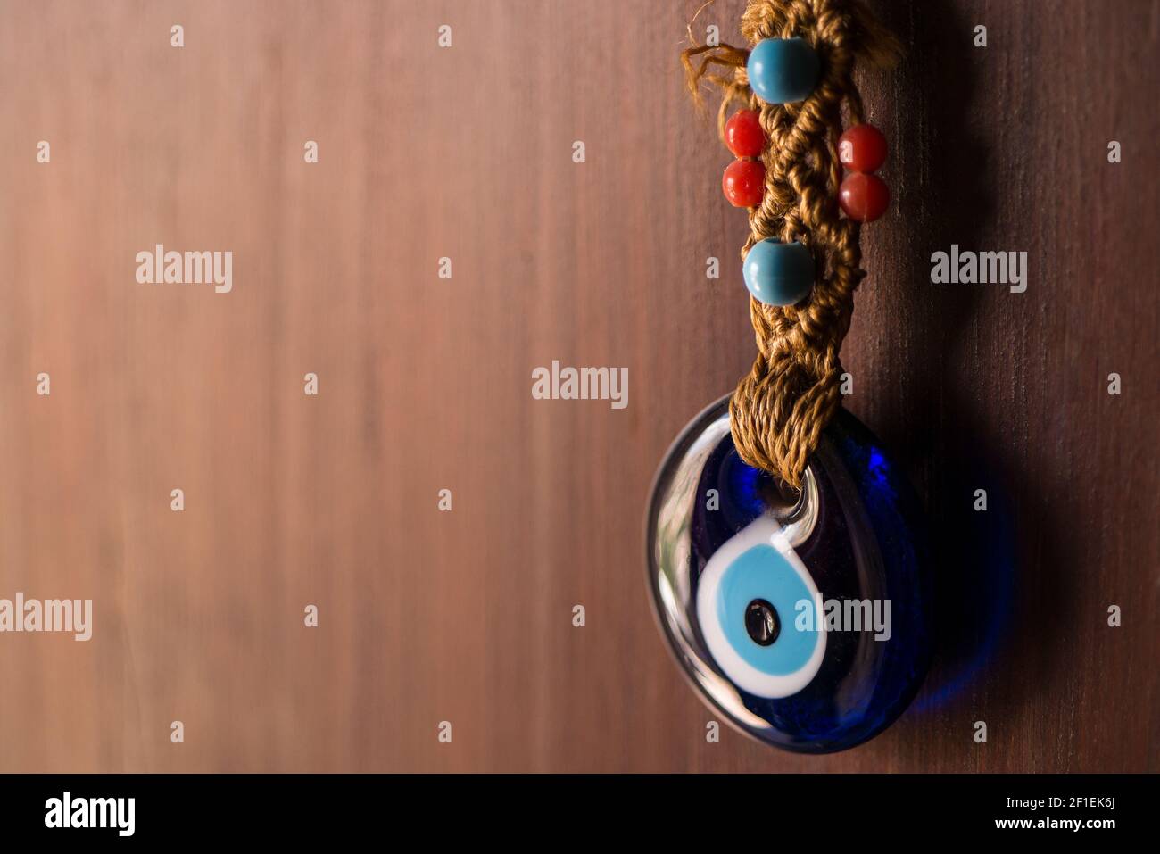 Traditional Turkish Blue Evil Eye Amulet and Charm hanging at the front of doors in Turkey Stock Photo