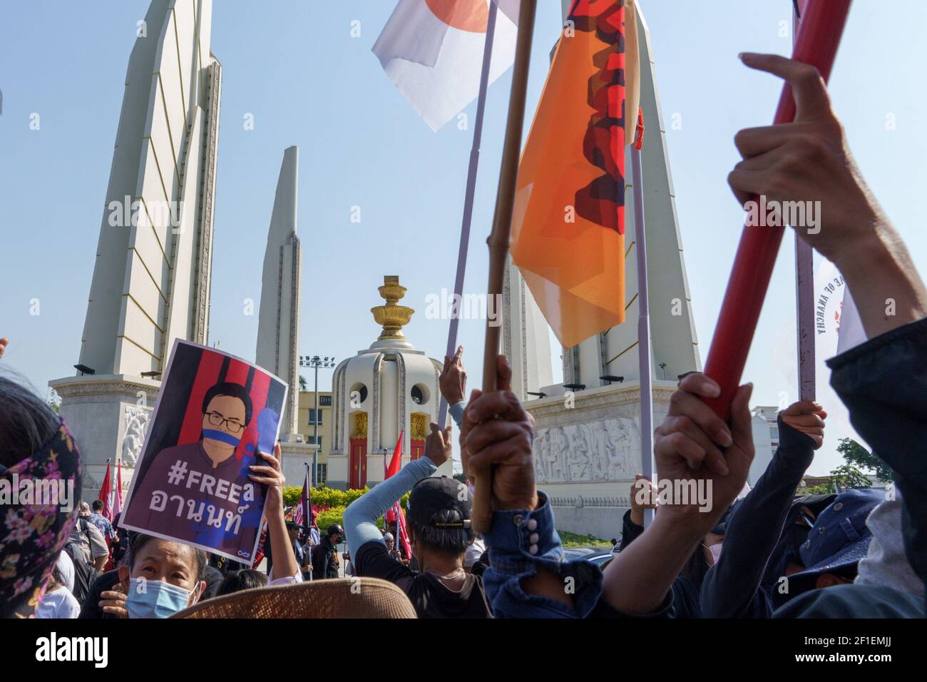 A protestor holding a portrait of Arnon Nampa, during the demonstration. A group of protestors led by Jatupat 'Pai' Boonpattararaksa, one of the Thai pro-democracy leaders arrives at the Democracy monument while protesting against the imprisonment of 4 pro-democracy activists (Somyot Pruksakasemsuk, Patiwat Saraiyam, Parit 'Penguin' Chivarak, and Anon Nampa) who were arrested under the lese majeste law (Article 112 of the Thai criminal code) and demand the reform of the monarchy and abolition of the lese-majesty law. Stock Photo