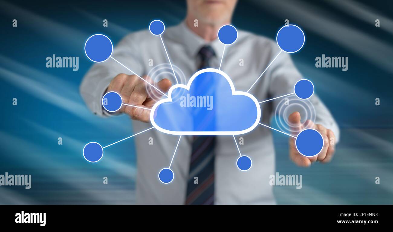 Man touching a cloud networking on a touch screen with his fingers ...