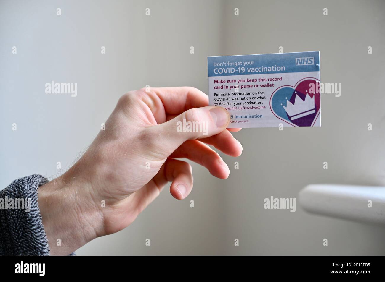NHS COVID-19 Vaccination Card. Stock Photo