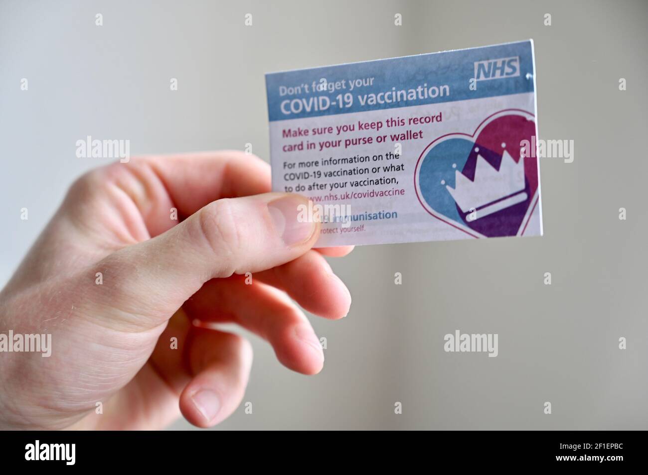 NHS COVID-19 Vaccination Card. Stock Photo