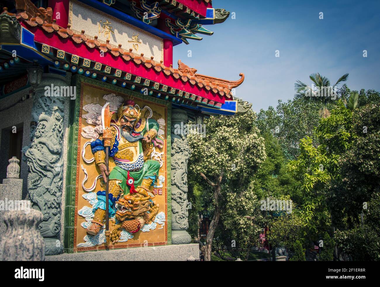 Color low relief of god warrior in Sik Sik Yuen Wong Tai Sin Temple at Hong Kong. Stock Photo