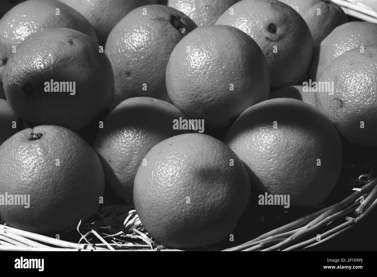 Oranges orange basket isolated Black and White Stock Photos & Images