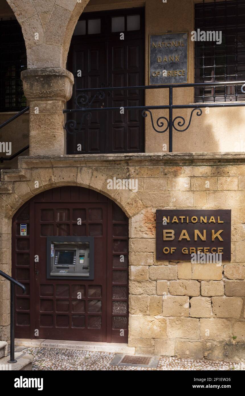 Rhodes, Greece - 01 June 2019: Bank office and ATM of the National Bank of Greece in the architecture of Old Rhodes Stock Photo