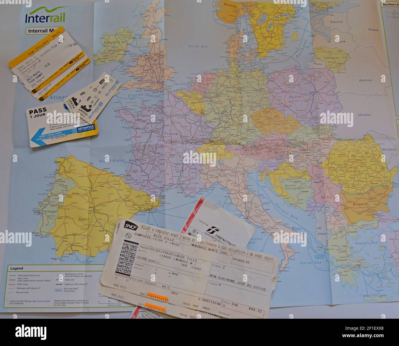 A selection of French and Irish train tickets on an Interrail map of Europe, ready to travel by rail across Europe Stock Photo
