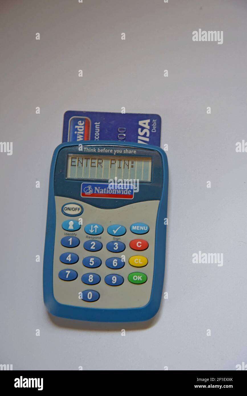 A Nationwide Building Society bank card reader for secure internet banking  with a Visa debit card inserted Stock Photo - Alamy