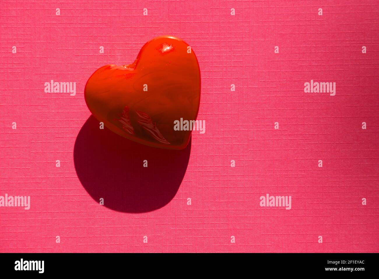 Red heart Background Valentine's Day Theme on pink paper sheet Stock ...
