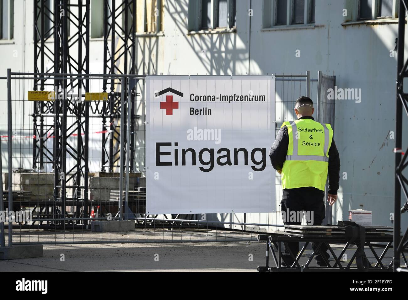 A security officer stands in front of the entrance to a new COVID-19 vaccination centre at the former Tempelhof airport in Berlin, Germany March 8, 2021. Tobias Schwarz/Pool via REUTERS Stock Photo