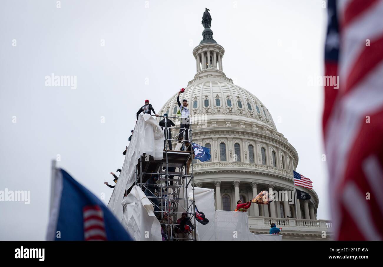 Supporters of U.S. President Donald Trump violently attack the U.S. Capitol building in order to stop vote counting in the 2020 elections. Stock Photo