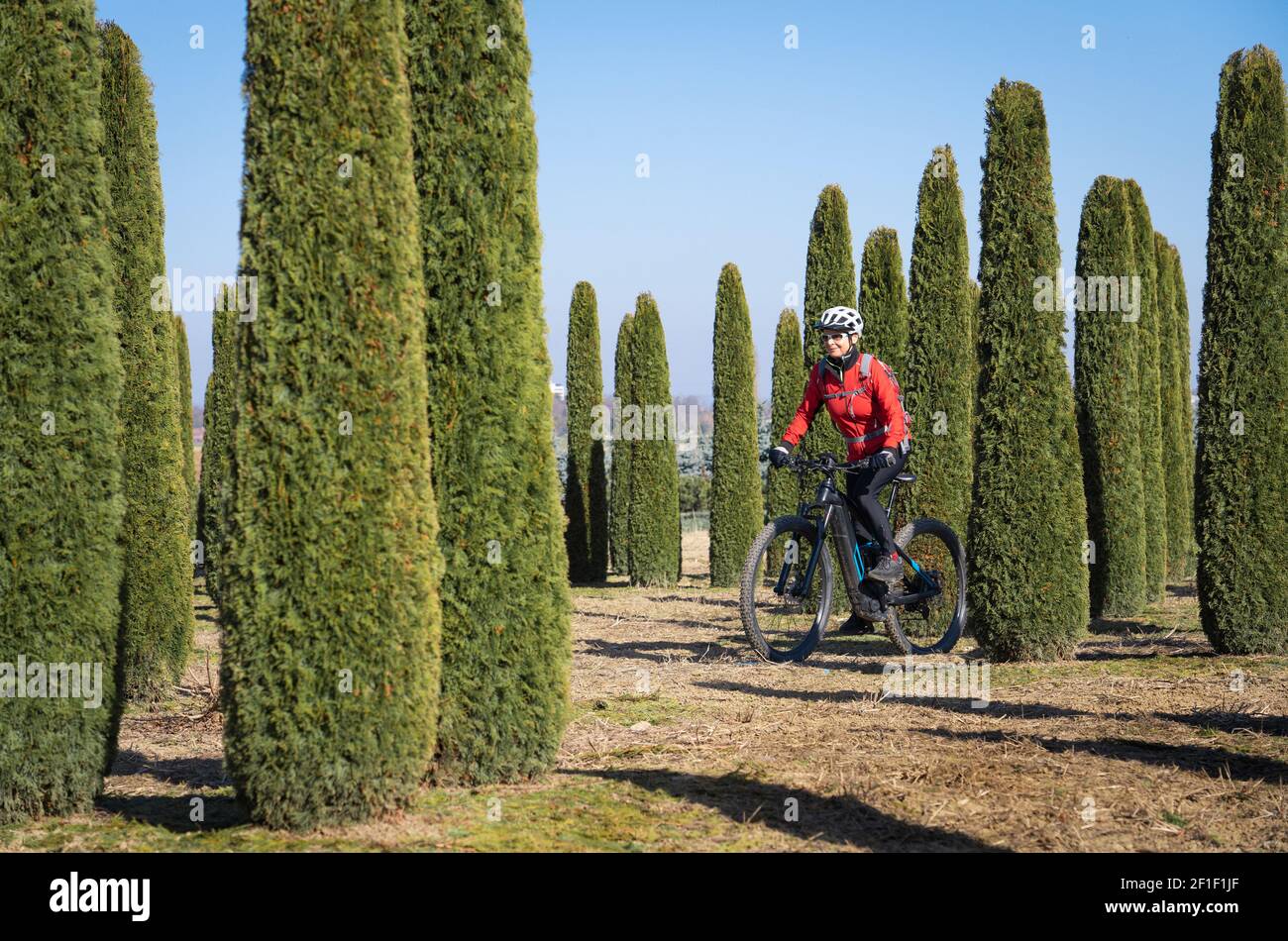 senior woman riding her electric mountain bike up to the Lindau Hut below  the famous summits of Drusenfluh and Three towers in the Montafon Area of  Vo Stock Photo - Alamy