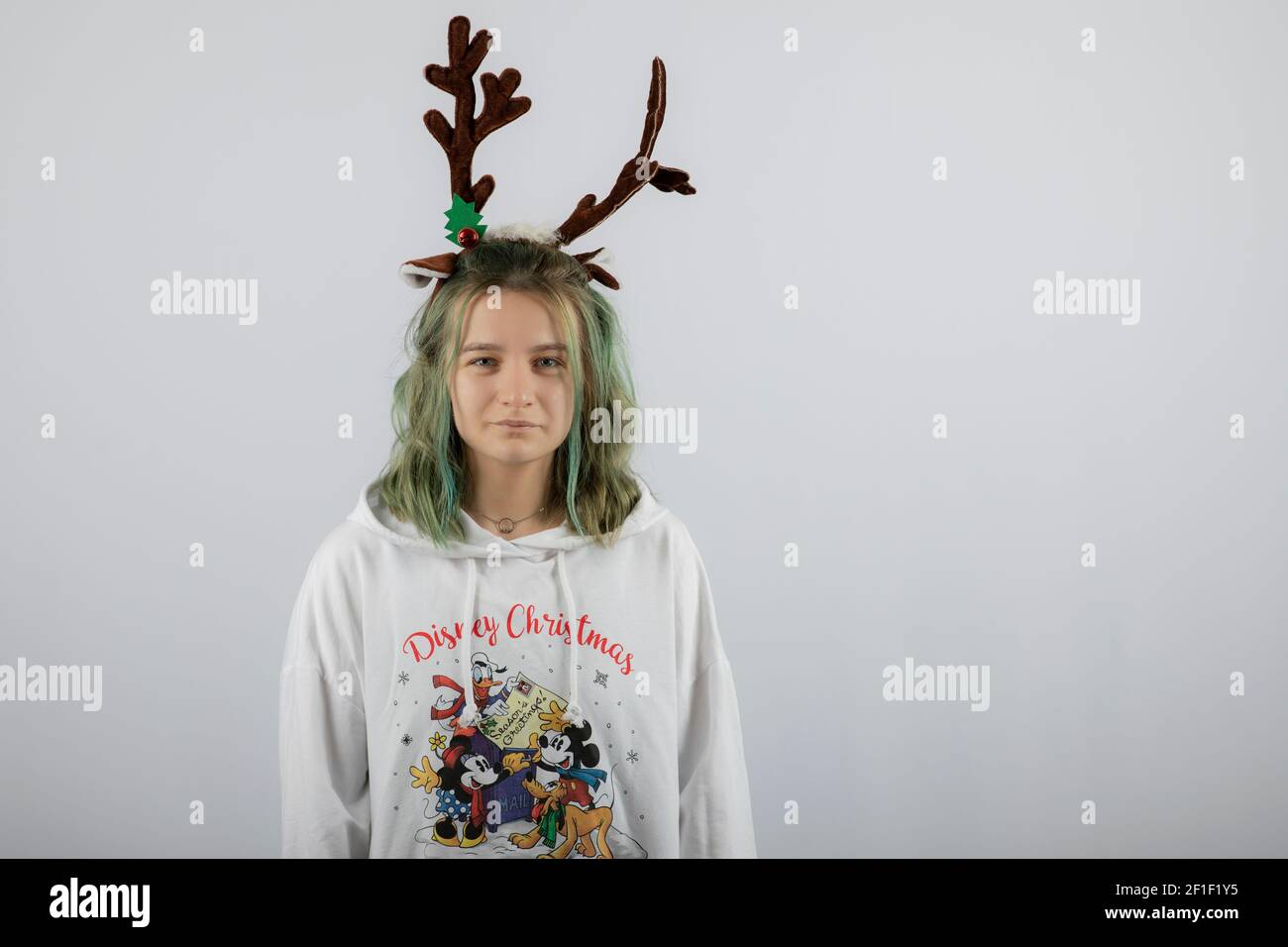 Picture of a young girl model standing against white background Stock Photo