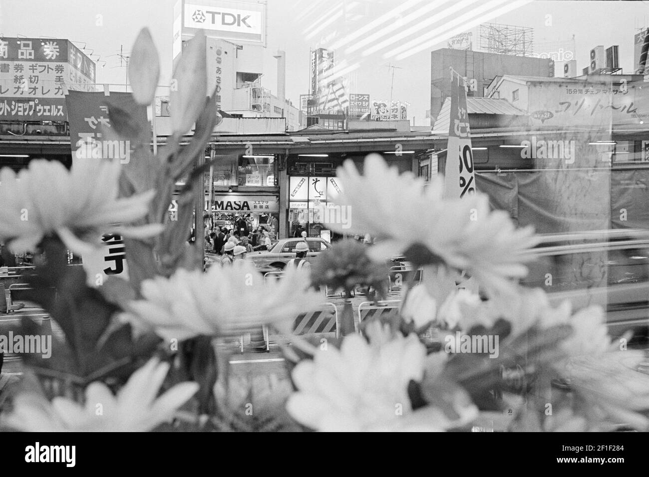 Plastic flowers and cityscape , Tokyo , Japan Stock Photo