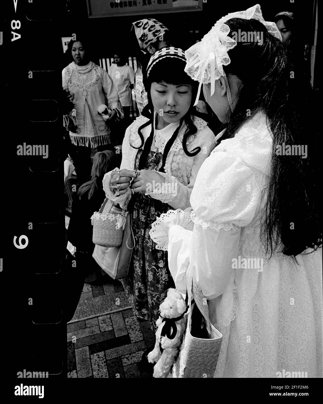 Japanese teenage girls dressed in Tokyo street fashion, Yoyogi park, Harajuku, Japan Stock Photo