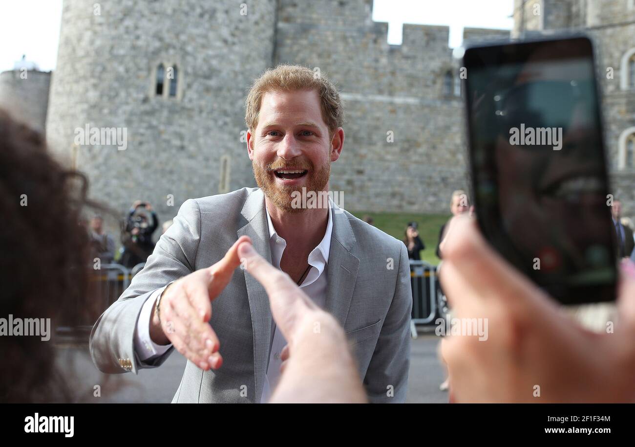 Britain's Prince Harry (L), and Prince William (R) gesture to the crowd in Windsor, Britain, 17 May 2018. Stock Photo