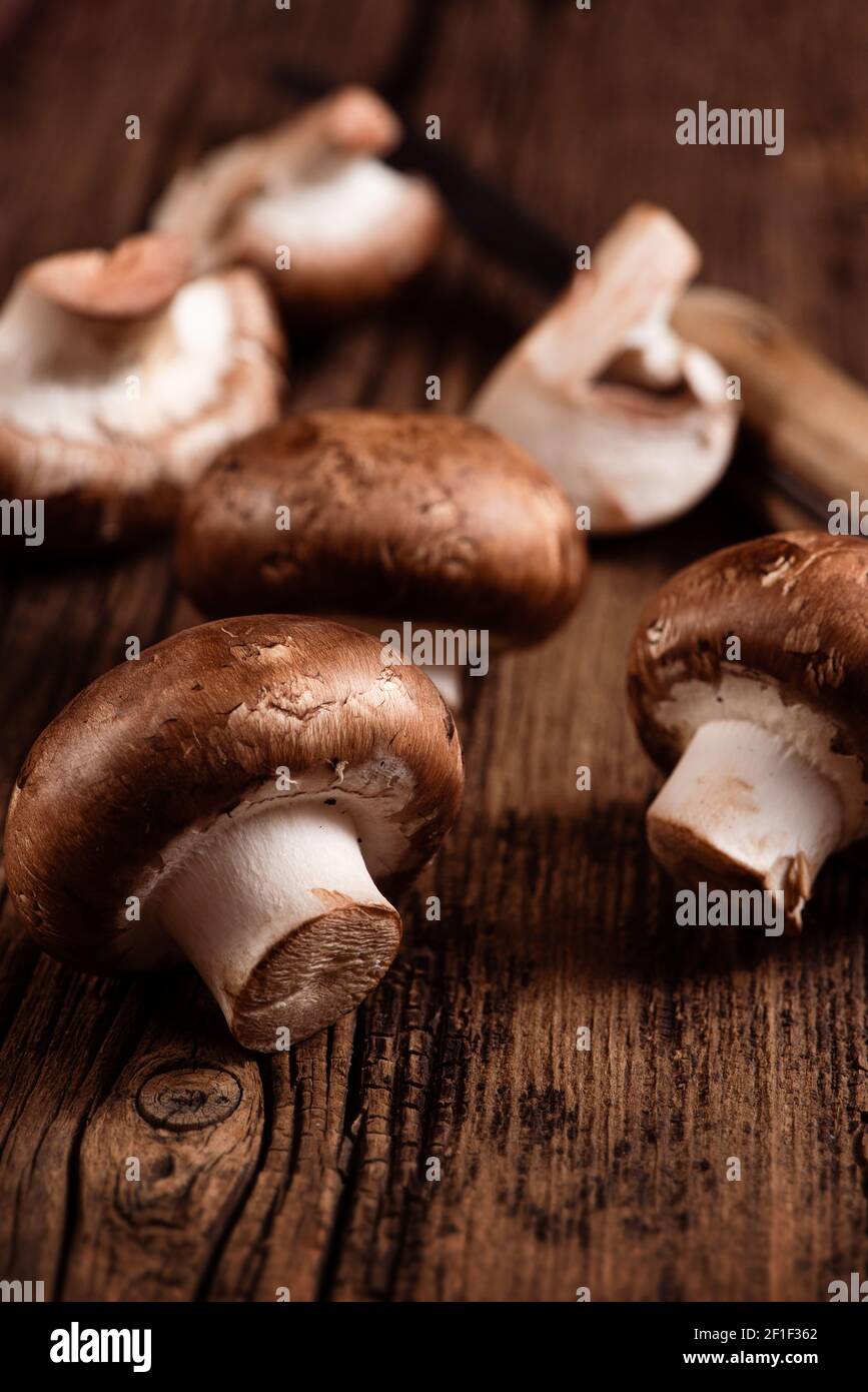 Royal champignon on wooden table. Crimini mushrooms. Closeup Stock Photo