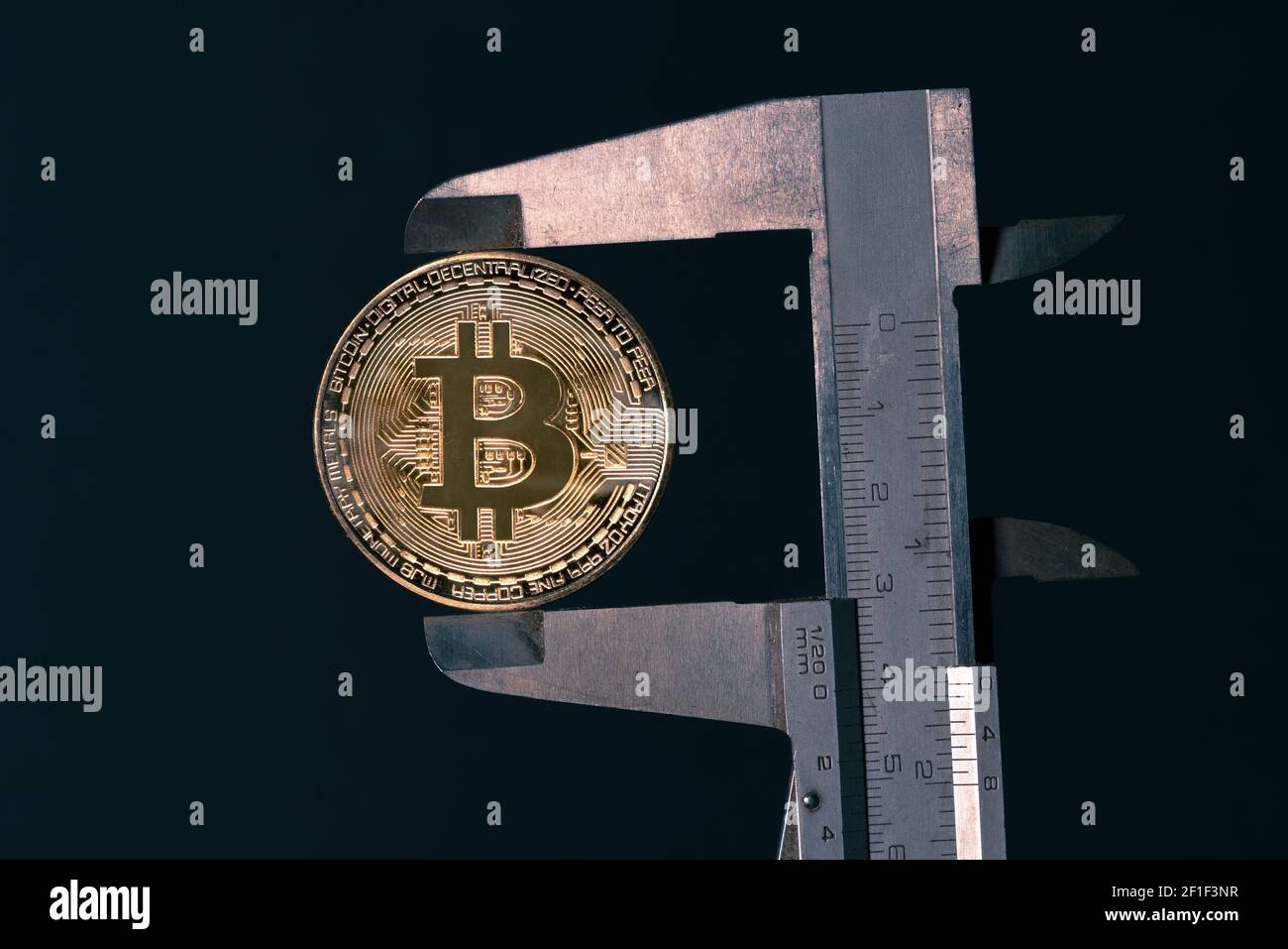 Golden bitcoin mounted in a drawer. Assessing bitcoin value. Crypto  currency restrictions. Investing instruments. Measuring crypto potential  Stock Photo - Alamy