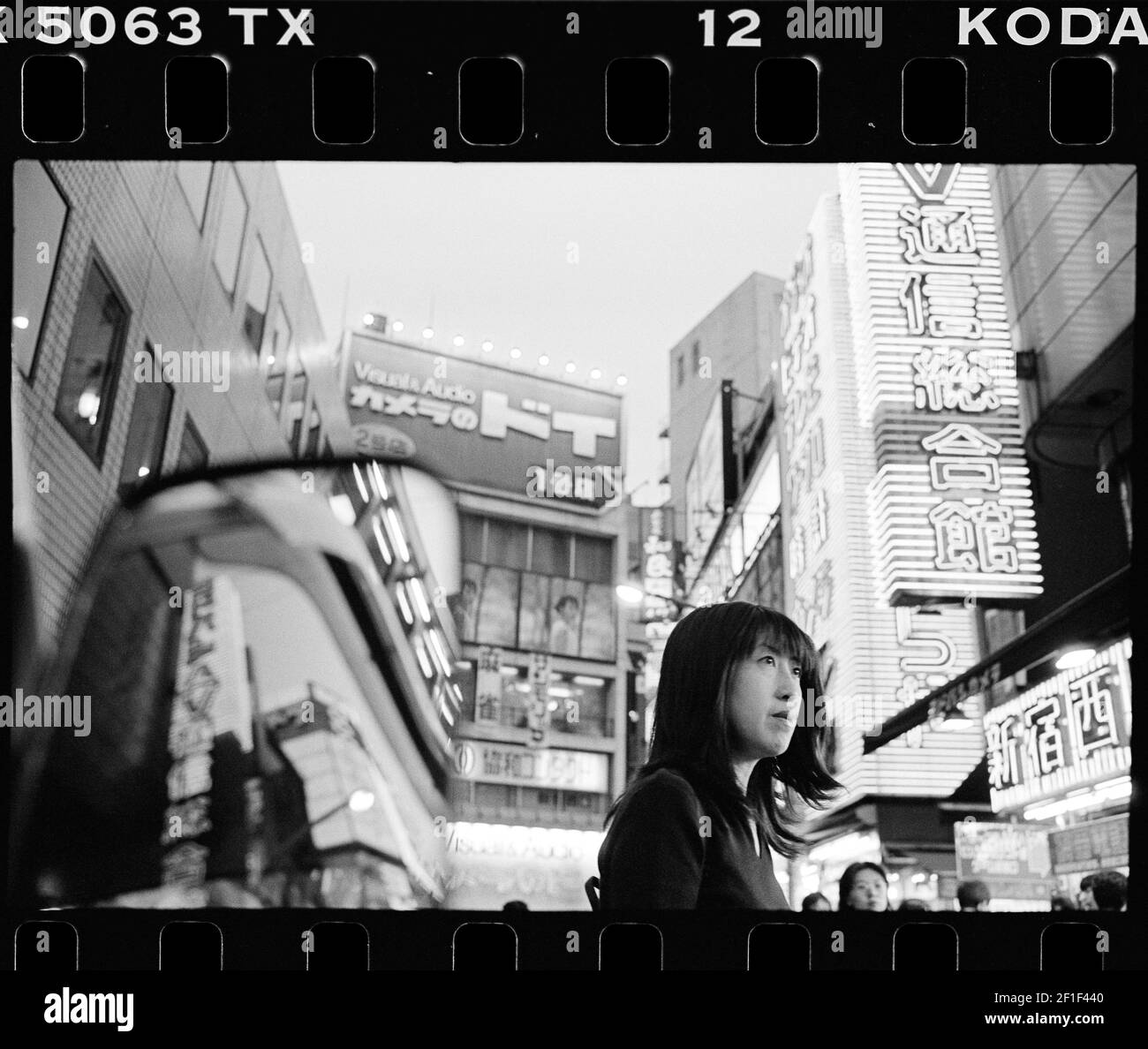 Shinjuku, Tokyo ,1998 , Japanese girl with neon lights in background Stock Photo