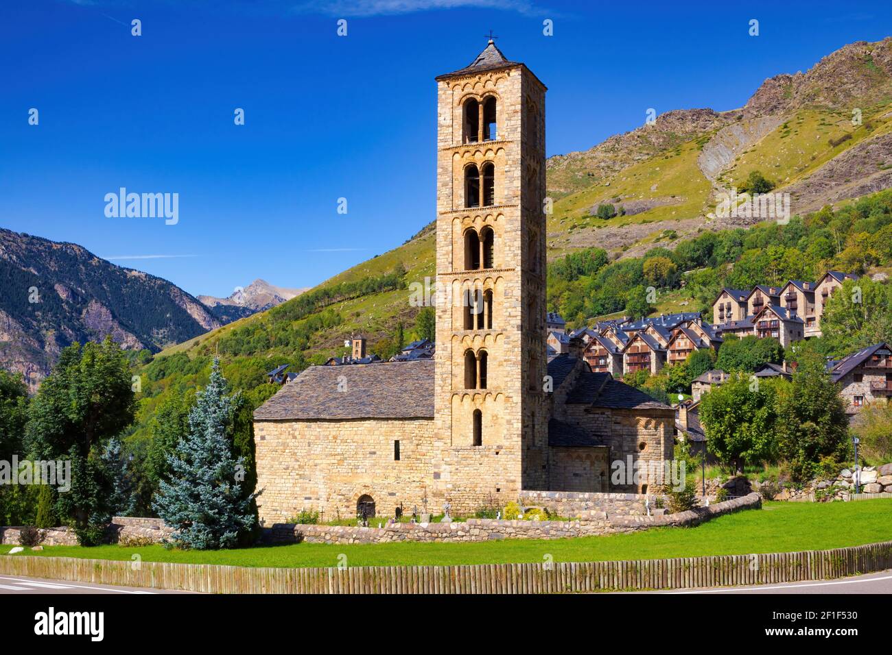 View of the side of the church of St. Climent in Taull with the five-story Romanesque bell tower of the 12th century, declared a UNESCO heritage site. Stock Photo