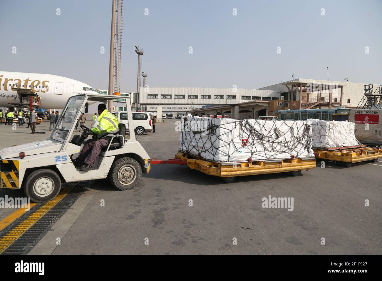 Kabul, Afghanistan. 8th Mar, 2021. An airport worker transports COVID-19 vaccines from COVAX, an international program devised to help low and middle-income countries to have more access to COVID-19 vaccines, at Hamid Karzai International Airport in Kabul, capital of Afghanistan, March 8, 2021. Credit: Sayed Mominzadah/Xinhua/Alamy Live News Stock Photo