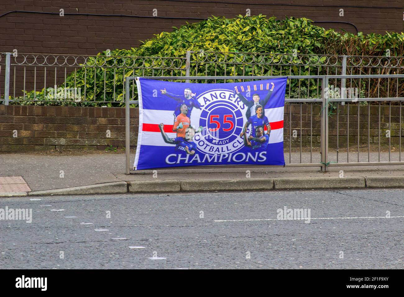 Newtownards, UK. 8 March 2021 A victory banner tied to a road safety crossing barrier in George Street Newtownards celebrating Glasgow Rangers famous Scottish Premier League victory on 7 March 2021. Credit: MHarp/Alamy Live News Stock Photo