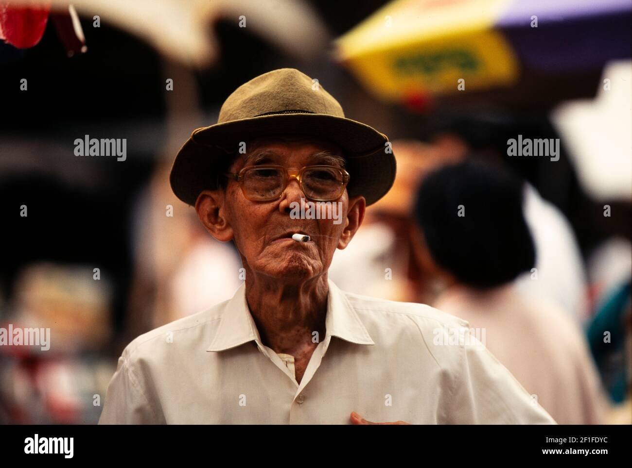 Cigarette smoker, Ho Chi Minh City, Vietnam, June 1980 Stock Photo