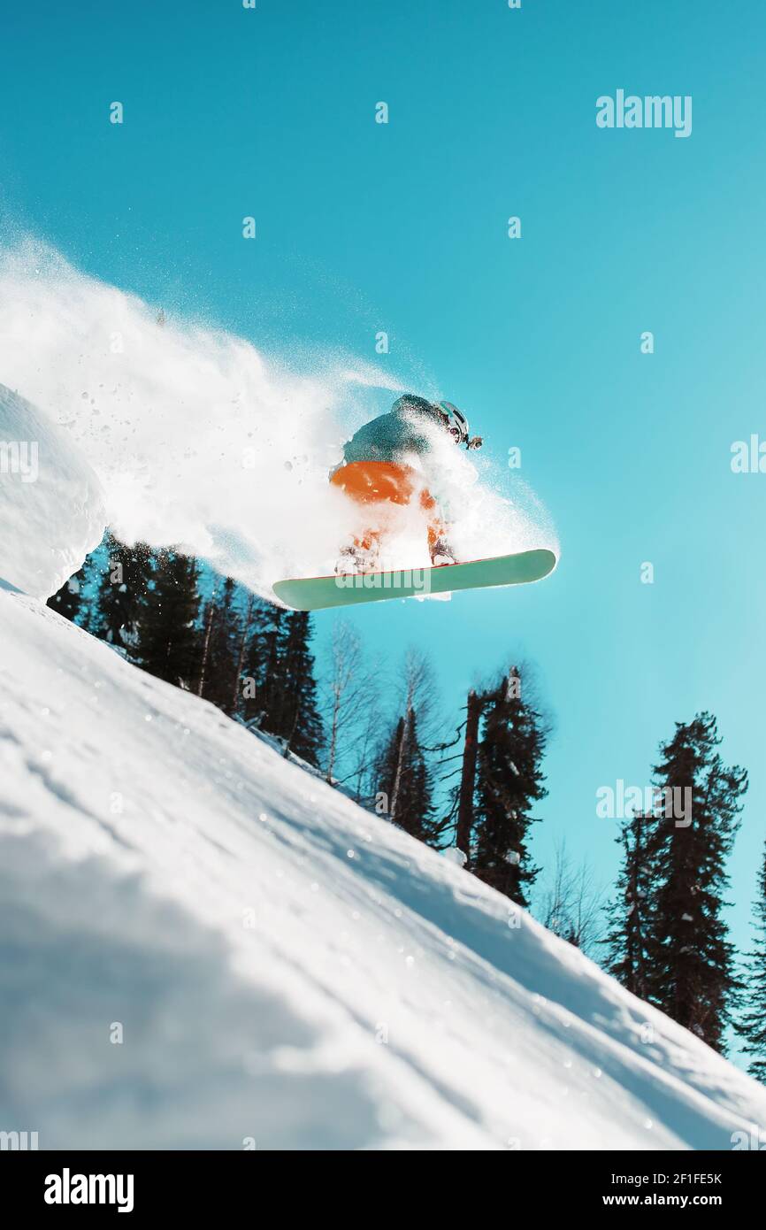 Snowboarder jumps from springboard hi-res stock photography and images ...