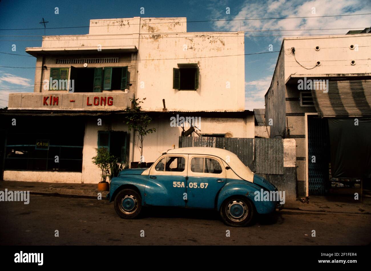 An old taxi outside Golden Dragon hotel, Ho Chi Minh City, Vietnam, June 1980 Stock Photo