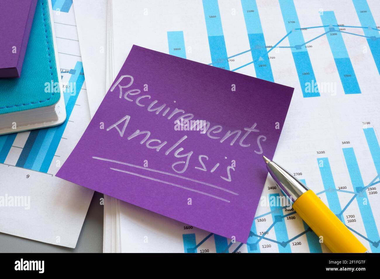 Requirements analysis report with papers and charts. Stock Photo