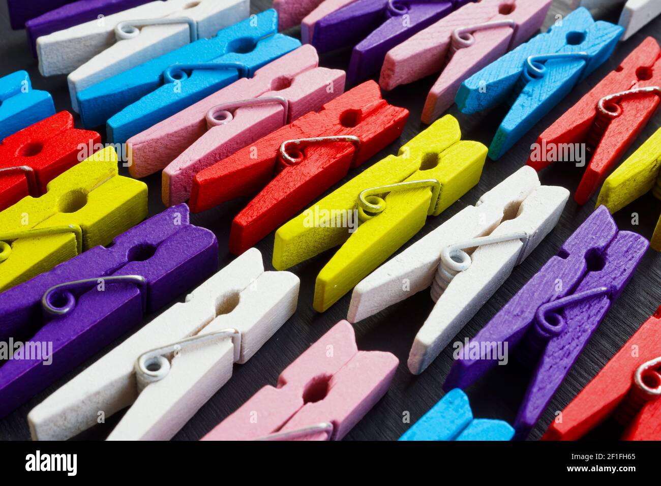 Background from multi-colored clothespins. Diversity and inclusion concept. Stock Photo
